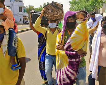 Migrant labourers walking home