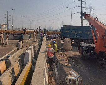 Delhi Police removing barricades at Tikri, Ghazipur borders