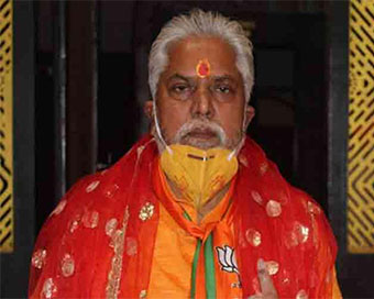 Bihar Minister Prem Kumar in trouble for wearing lotus mask