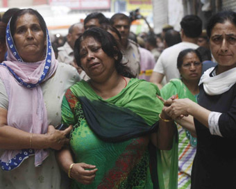 New Delhi: An aggrieved relative of the family, 11 members of which were found dead -- some blindfolded and hanging from an iron grill ceiling -- at their home, in New Delhi on July 1, 2018. According to Joint Commissioner of Police Rajesh Khurana, w