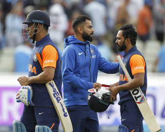 Birmingham: Indian skipper Virat Kohli shakes hands with Kedar Jadhav after the 38th match of World Cup 2019 between India and England at Edgbaston stadium in Birmingham, England, on June 30, 2019. Also seen MS Dhoni. (Photo: Surjeet Yadav/IANS)