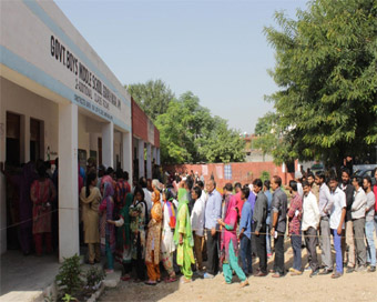 Jammu: People queue up outside a polling booth in Jammu during the first phase of Municipal polls in Jammu and Kashmir that is taking place after a gap of 13 years; on Oct 8, 2018. (Photo: IANS)