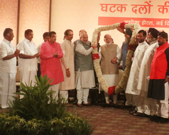 New Delhi: Prime Minister Narendra Modi during NDA dinner hosted by BJP chief Amit Shah at Ashoka Hotel in New Delhi on May 21, 2019. Also seen Tamil Nadu Chief Minister K Palaniswami, Deputy Chief Minister O Panneerselvam, Shiv Sena President Uddhav