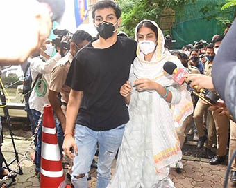 Rhea Chakraborty with her brother outside ED office