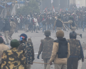 New Delhi: Agitators clash with police personnel during their protest against the Citizenship Amendment Act (CAA) 2019 in North East Delhi