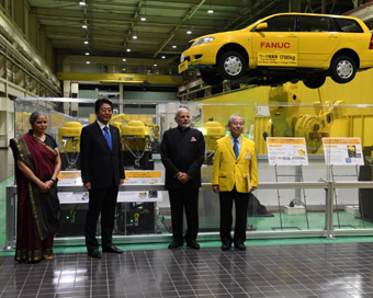 Yamanashi: Prime Minister Narendra Modi and Japanese Prime Minister Shinzo Abe visit FANUC Corporation facility in Yamanashi, Japan on Oct 28, 2018. (Photo: IANS/MEA)