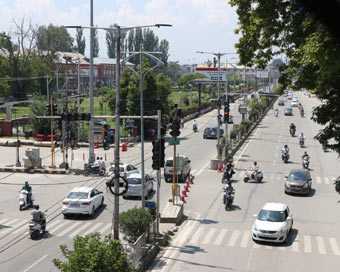 Vehicles ply on a Srinagar road