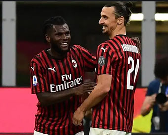 Rafael Leao celebrating with Zlatan Ibrahmovic